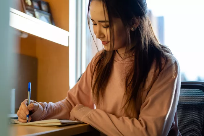 Student studying inside residence