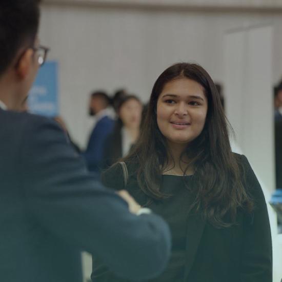 MMPA students speaking at networking event