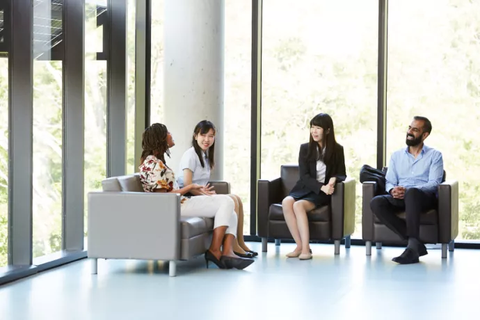 MMPA students sitting inside campus